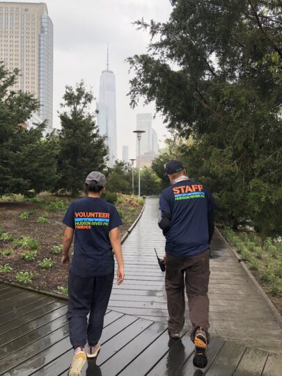 Volunteer and Staff members walk down a path at Hudson River Park