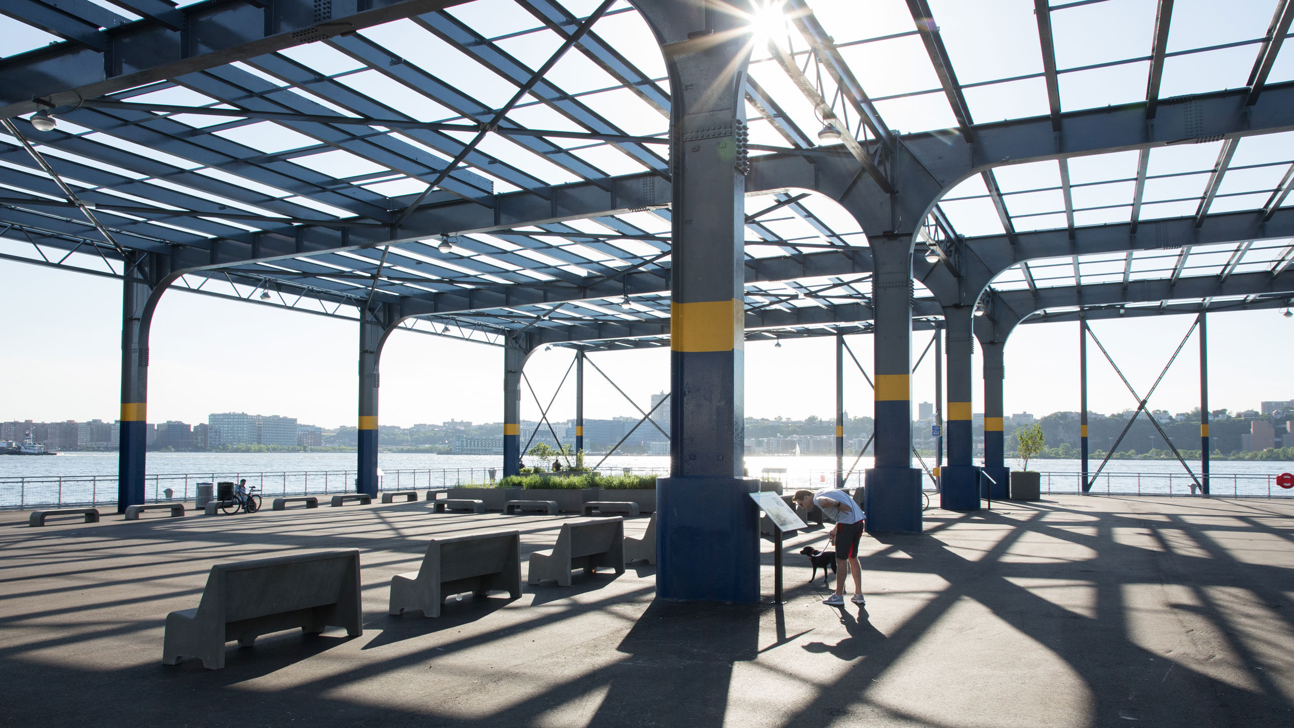 Man reads signage on the history of newly opened Pier 76 at Hudson River Park